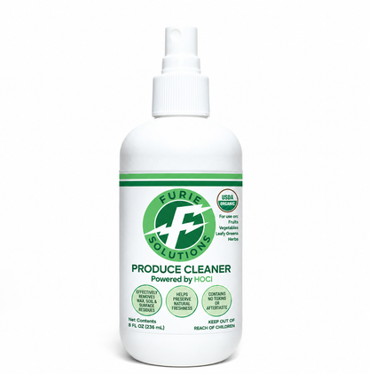 A white plastic bottle of Furie Solutions Produce Cleaner with a white spray nozzle and a green and white label, set against a plain white background.